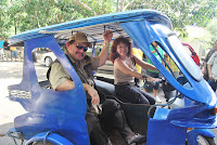 Diana Limjoco, CEO of Digital Webgroup, Inc, takes Mayor Hagedorn for a spin in the Etrike prototype.