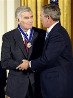 U.S. President George W. Bush presents actor Charlton Heston with the Presidential Medal of Freedom during a ceremony at the White House, in this July 23, 2003 file photo. Heston passed away at the age of 84, his family said on April 5, 2008. (Kevin Lamarque/Files/Reuters)