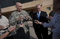 Army Gen. Ray Odierno, commander of Multi-National Force - Iraq, and U.S. Ambassador to Iraq Christopher Hill speak to the media at the U.S. Embassy in Baghdad, Iraq, on Dec. 19.