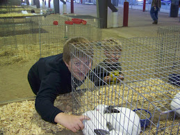 Trent Examines the Grand Champion Rabbits
