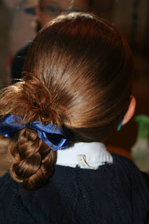 Back view of young girl modeling "Ponytail Half Braid" hairstyle