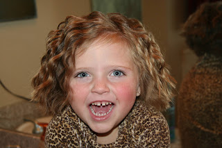 Portrait of young girl modeling 3-barrel curl hairstyle on her a-line bob