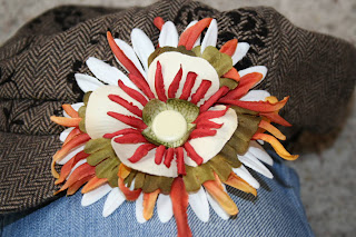 Brown hat with multi-color flower