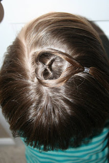 Top view of girl modeling "teen heart" hairstyle 4