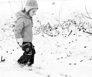 Child playing in the snow 
