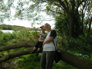 family pose on a crack willow by swan lake, portsmouth