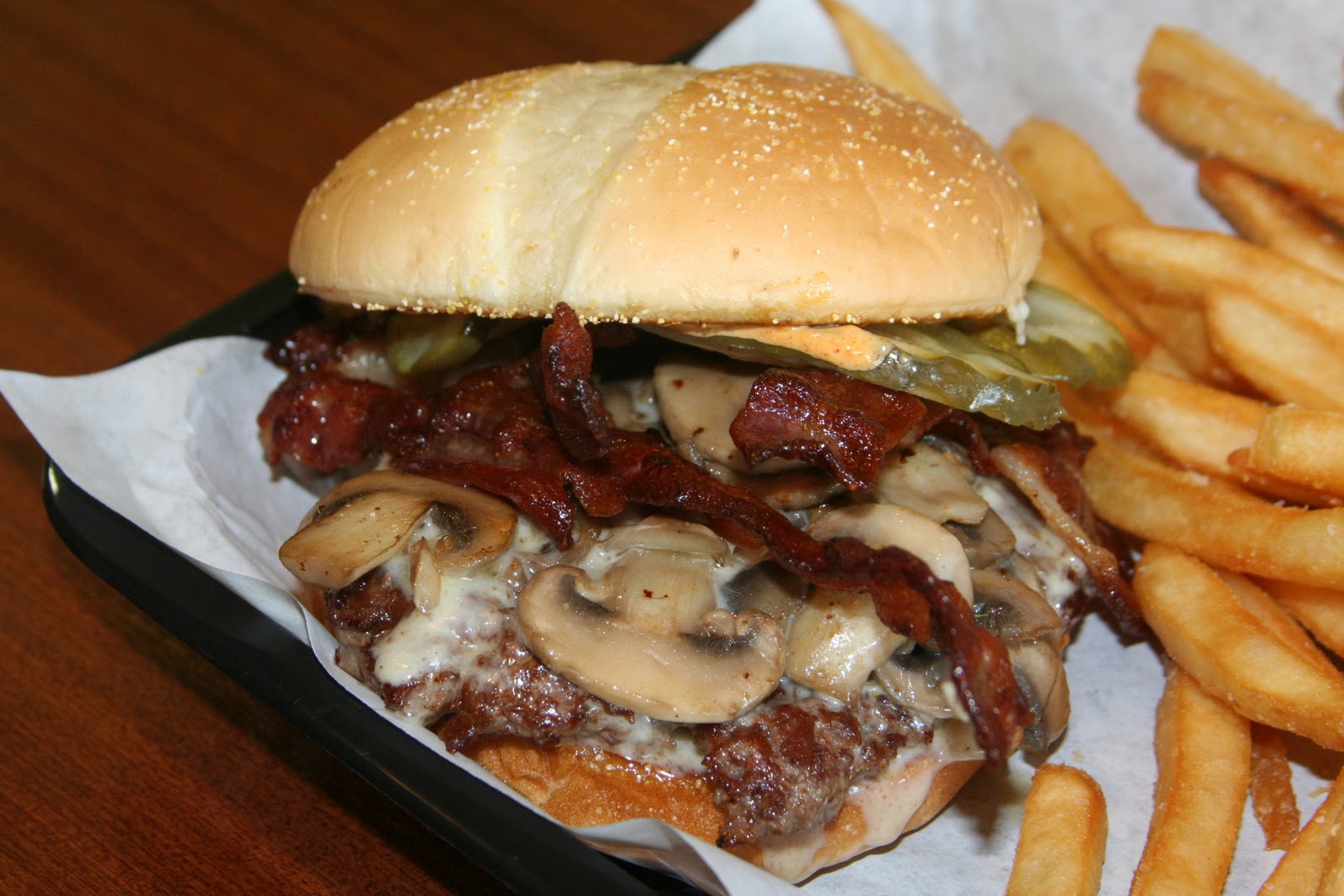 BIG GUY SHARING FOOD KILLER BURGER 47TH and Sandy