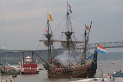 HALF MOON salutes the Newburgh Harbor as she prepares to dock next to the paddle wheeler RIVER ROSE