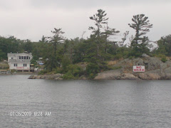 Henry's-- behind a one rock island--with trees.  Henry's has 8 long docks.Lots of room for diners