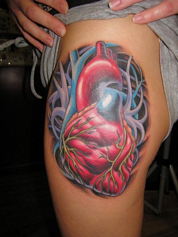 tattoos designs of hearts. real heart tattoo pictures