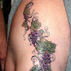 Grape Vine Tattoo Designs - Tattoo Project 2005 : The combination of wild flowers and vines is one that occurs in nature and looks impressive every time, even as a tattoo.