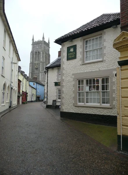 On the left, Cromer through one of its little alleyways, on the right the summit of Beeston Bump 