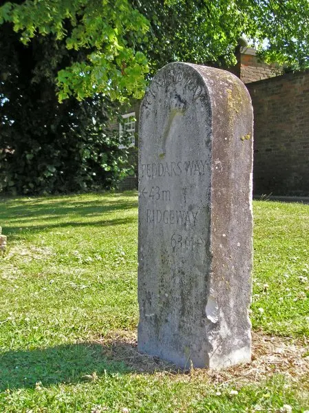 On the left, Basham village green. On the right, Icknield Way milestone - 43 miles to the Peddars Way, 63 miles to the Ridgeway.