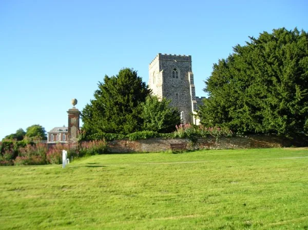 St Marys Church at Dalham, with Dalham Hall in the background 