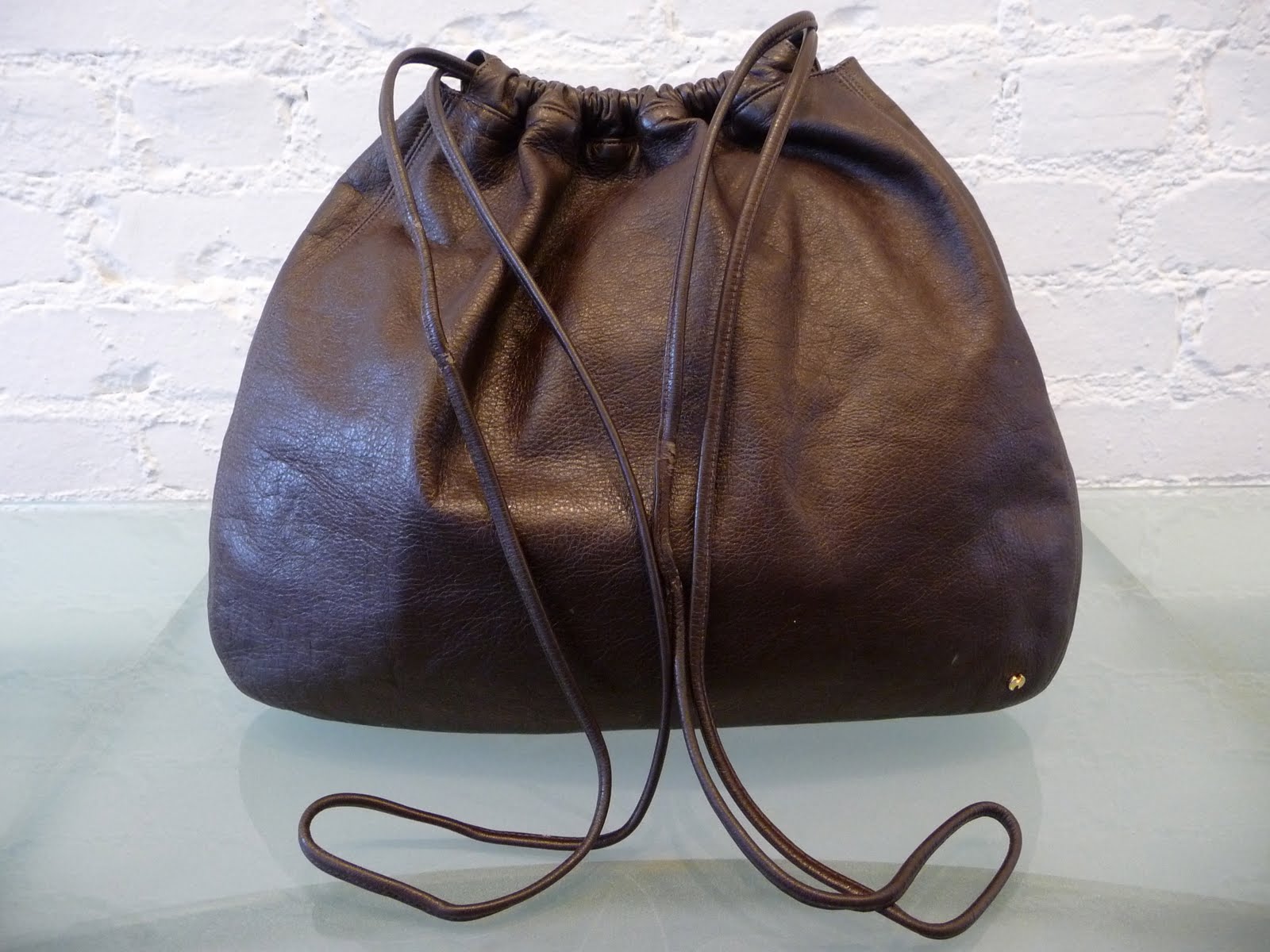 DECADES INC. "Over the shoulder boulder holder"