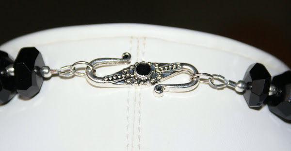 A view of the faceted black onxy necklace from the back...