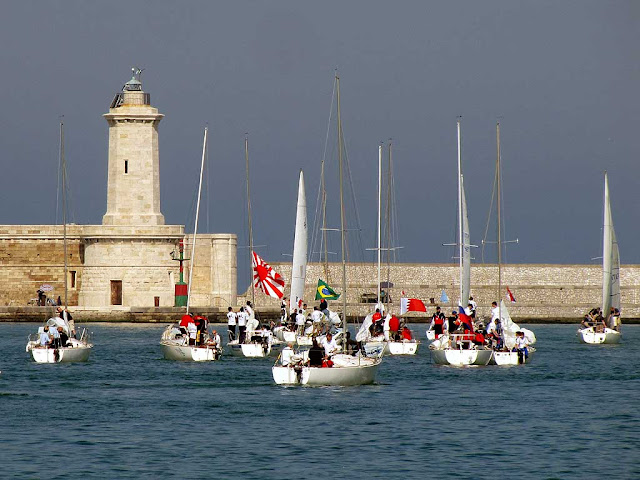 Sailboats leaving for a race, port of Livorno