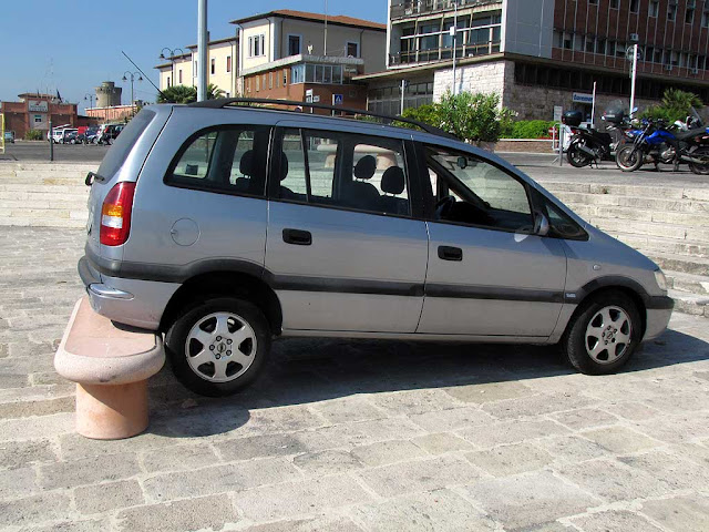 Car sitting on a bench, Porto Mediceo, Livorno