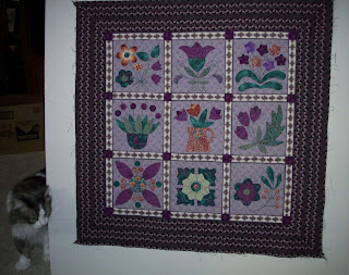 quilt top with nine applique flower blocks