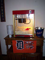 popcorn machine with Tigers towel hanging on bar
