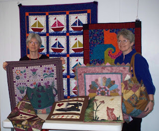 Tam Murphy and Jane Werner display the finished challenge projects