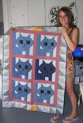 Brandi holding her Kittens quilt