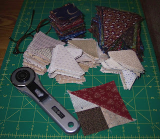 Fabric triangles and squares for mystery quilt