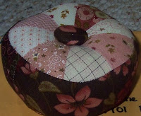 pink and brown patchwork pincushion