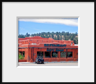 A framed photo of an adobe roadside diner in the American Southwest