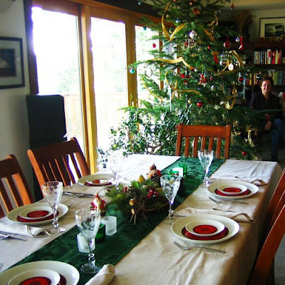 A holiday table is dressed in red and green.