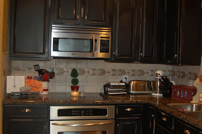 black speckled granite that only made the cabinets look, um, more pink