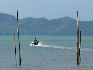 Fisherman heading out into the bay