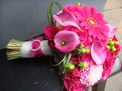 Bridal bouquet composed of Ravel roses hot pink mini callas dahlias 