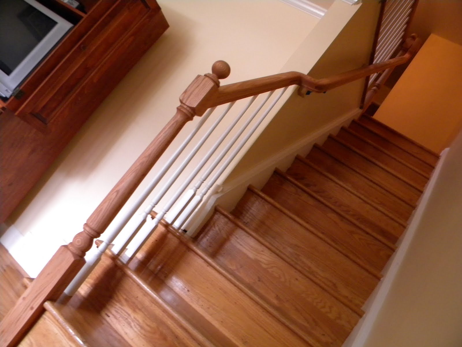 Wood Stairs and Rails and Iron Balusters Wood Handrail Replacement in