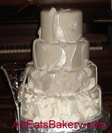 Four tier white fondant wedding cake