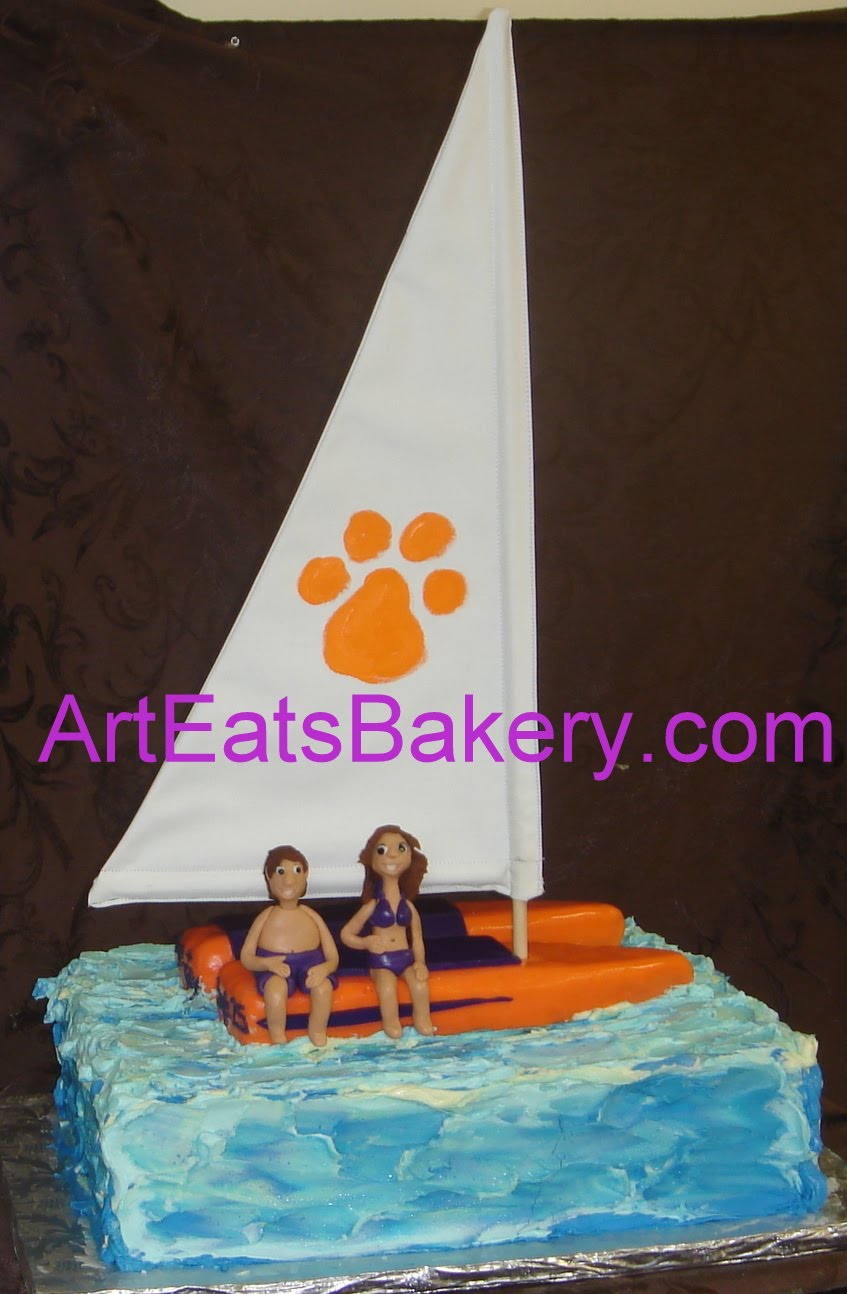orange and purple fondant and rice krispie trearts catamaran sailboat 