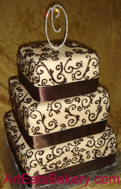 Three tier square ivory fondant custom wedding cake with elegant chocolate 
