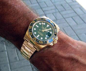 rolex submariner gold on wrist