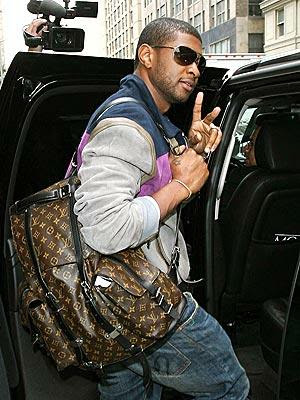 usher-with-louis-vuitton-carry-all Usher is #1 on Billboard  