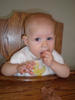 baby eating refried beans