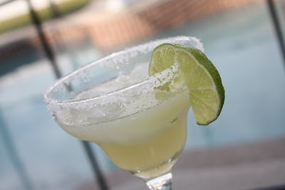 glass with margarita and salted rim and slice of lime