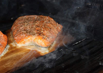 Cedar Plank Grilled Salmon cooking on a grill