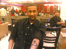 Milan Kuhhal wid his tatto