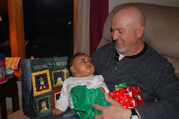 Tysa opening presents with Grandpa