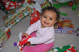 Opening lots of presents, she really liked the one that made noise!!  Go figure...