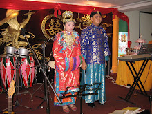 Mr Danny Teo and his bride going on stage to welcome the guests