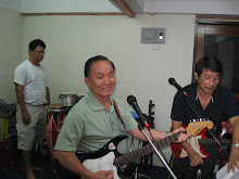 Mr Quek getting ready to practice the next song
