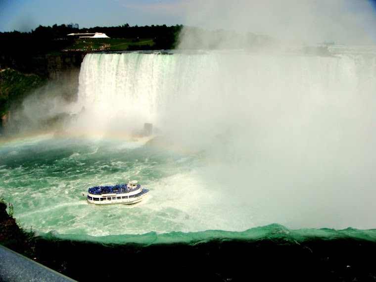 Tour Boat Enters the Mist of the Falls (See rainbow, too.)