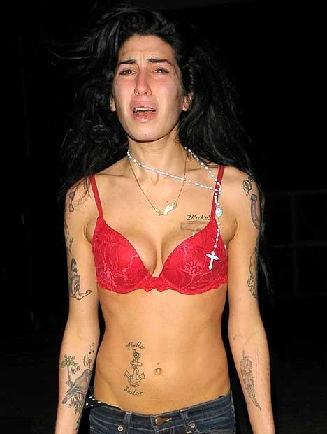 Amy Winehouse wanders the streets semi-naked - as her mother-in-law says: 'She's taking more drugs than ever'