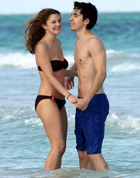 Drew Barrymore hits the beach in a teeny bikini